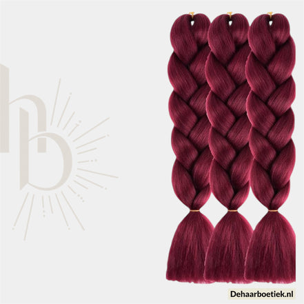 De haarboetiek invlecht haar bundel rood 