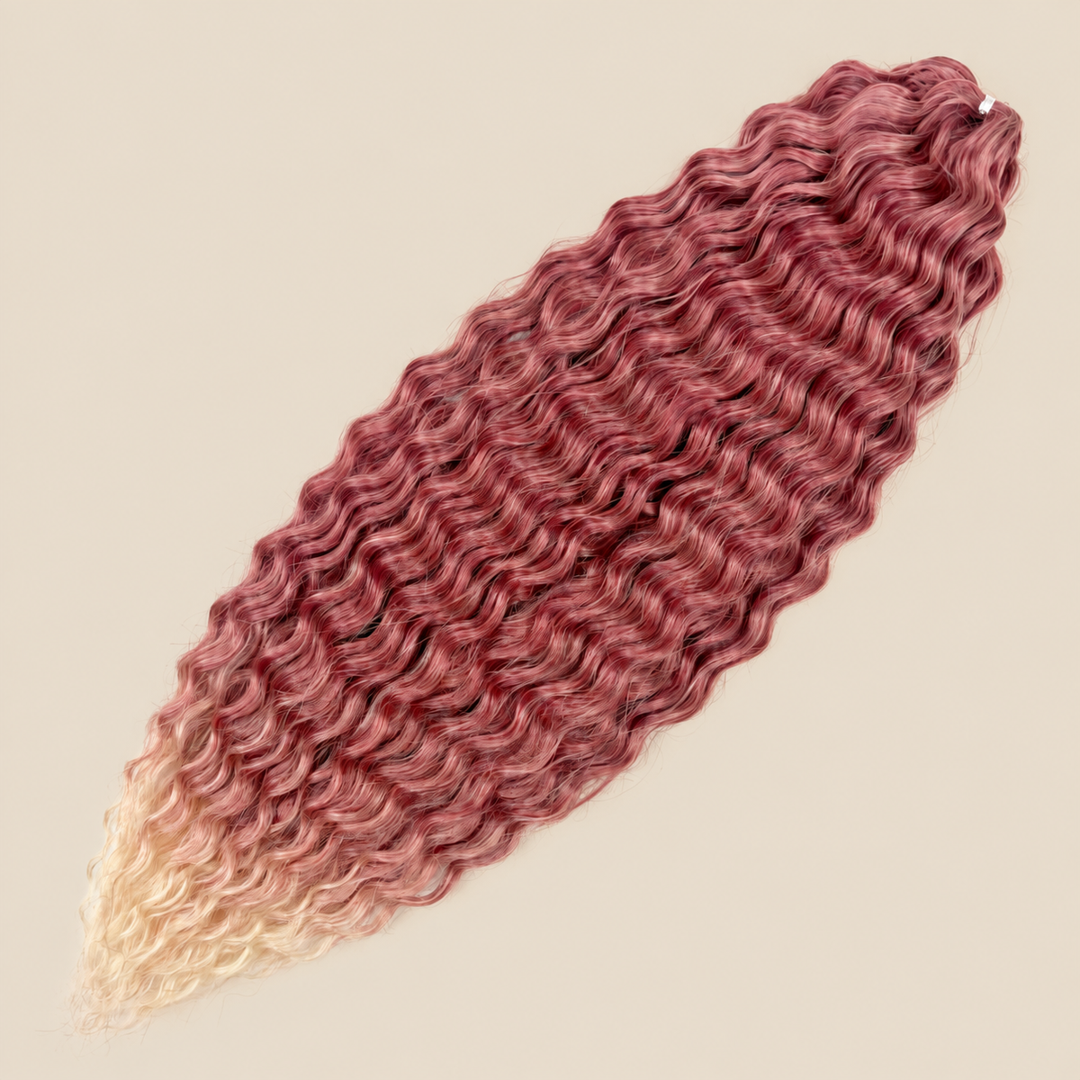 Ariel golvend kanekalon invlechthaar 55 cm 300 g in roze ombre (kleur T-BPink(16)) op beige achtergrond