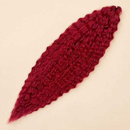 Ariel golvend kanekalon invlechthaar 75 cm 100 g in rood (kleur IRED3) op beige achtergrond