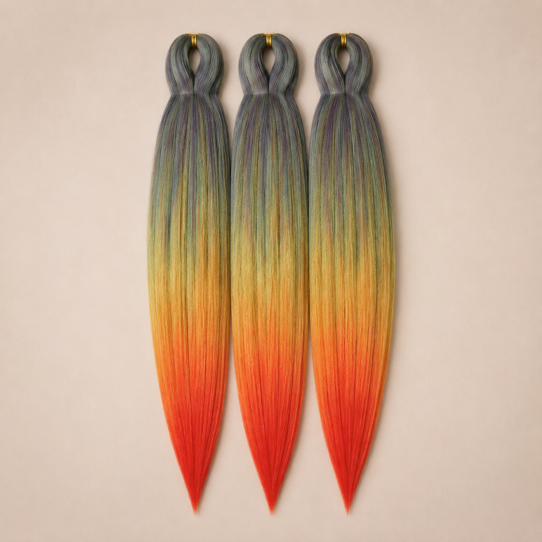 Flaming Rainbow 3-in-1 kanekalon invlechthaar Grijs, geel, oranje en rood op lichtbeige achtergrond