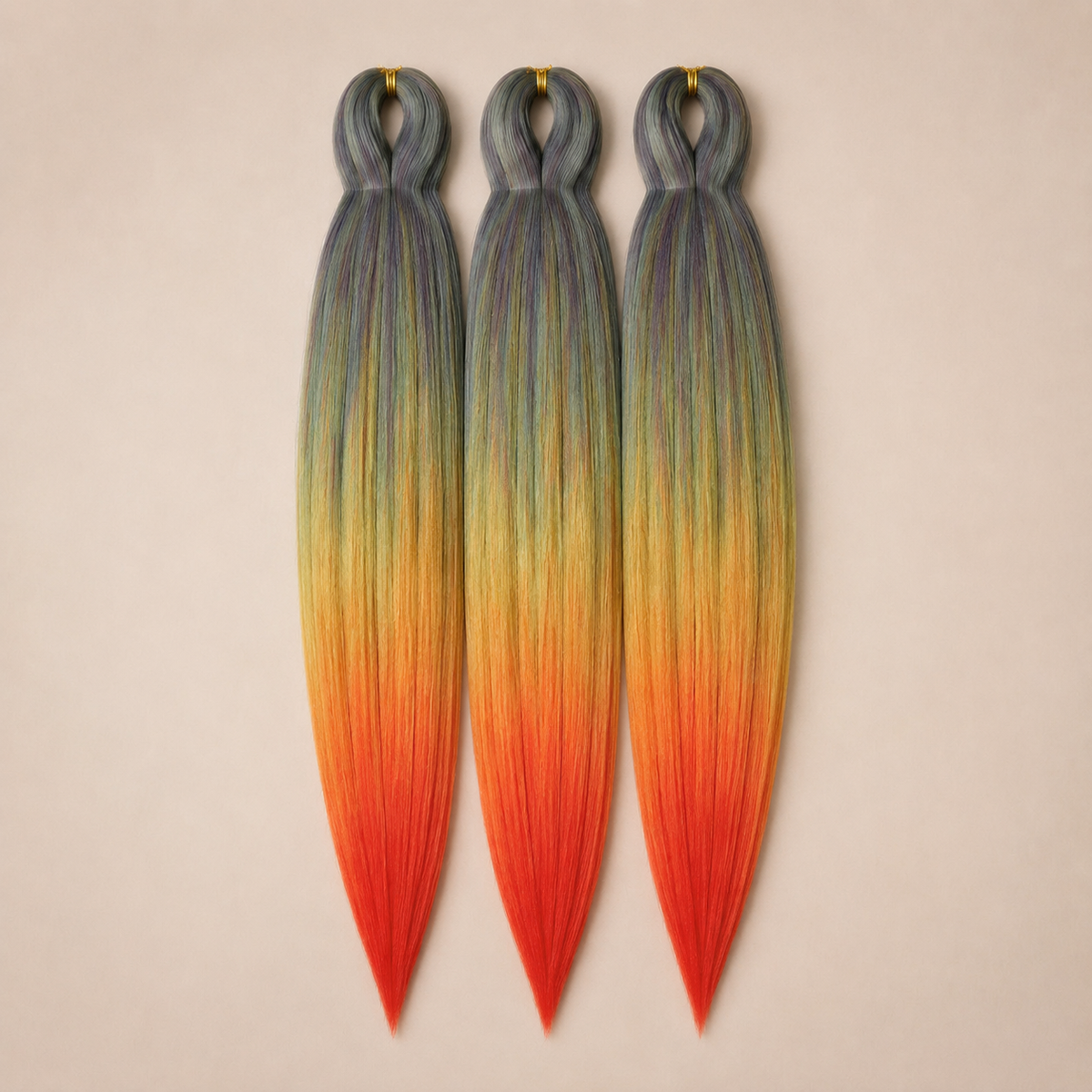 Flaming Rainbow 3-in-1 kanekalon invlechthaar Grijs, geel, oranje en rood op lichtbeige achtergrond