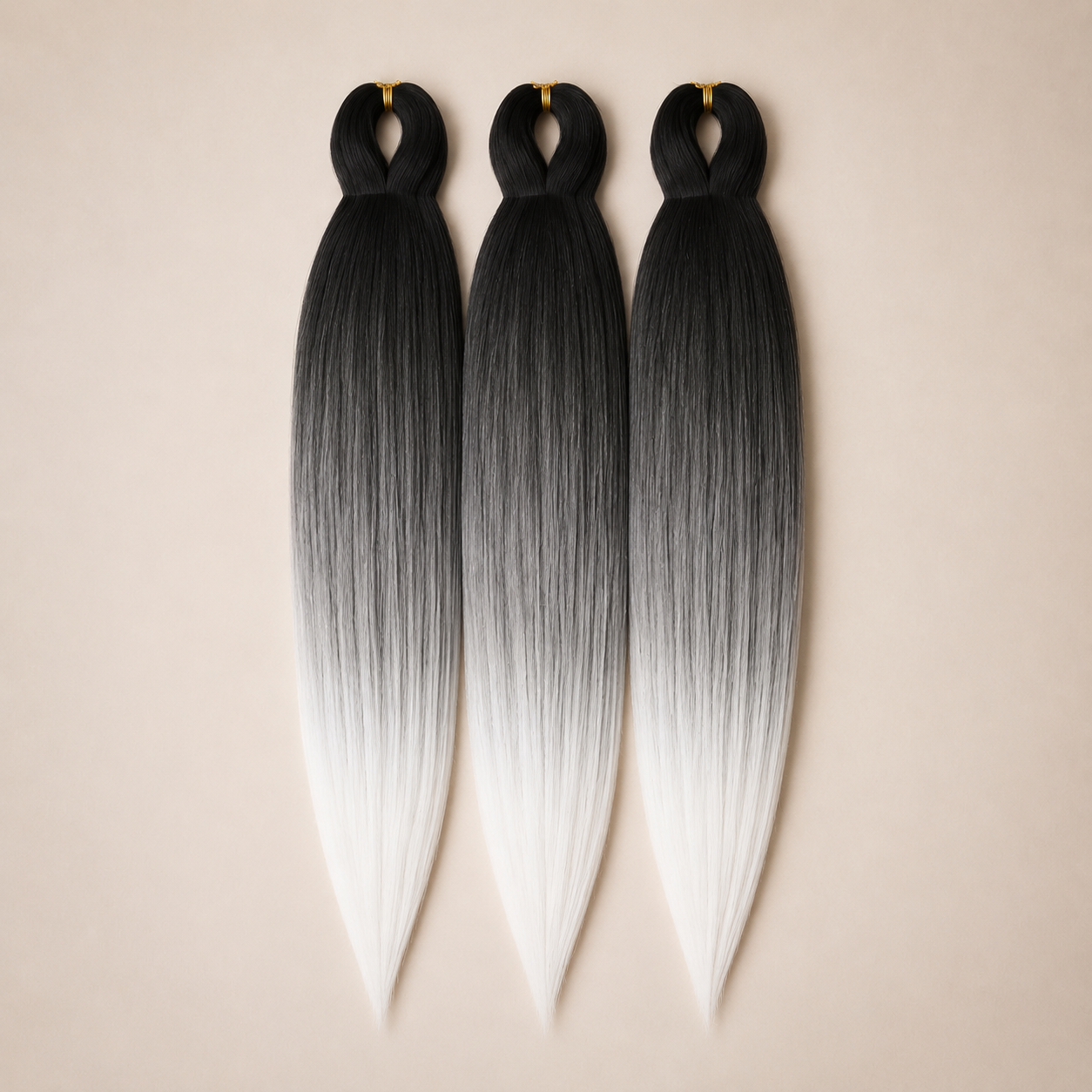 T1B/60 3-in-1 kanekalon invlechthaar Zwart via grijs naar wit op lichtbeige achtergrond