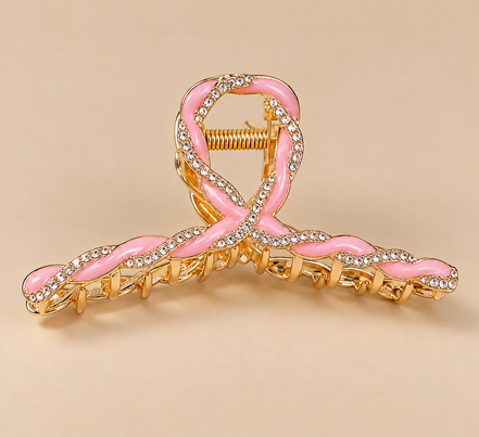 Luxe roze metalen haarklem met strass op beige achtergrond