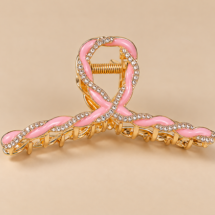 Luxe roze metalen haarklem met strass op beige achtergrond