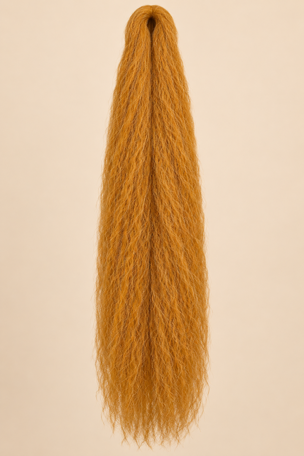 Jumbo Braid 100% Kanekalon Queen 60 cm – 27s koperblond op beige achtergrond