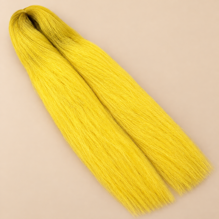 Ultra Braid kanekalon Yellow geel 110 cm, 155 gram op beige achtergrond