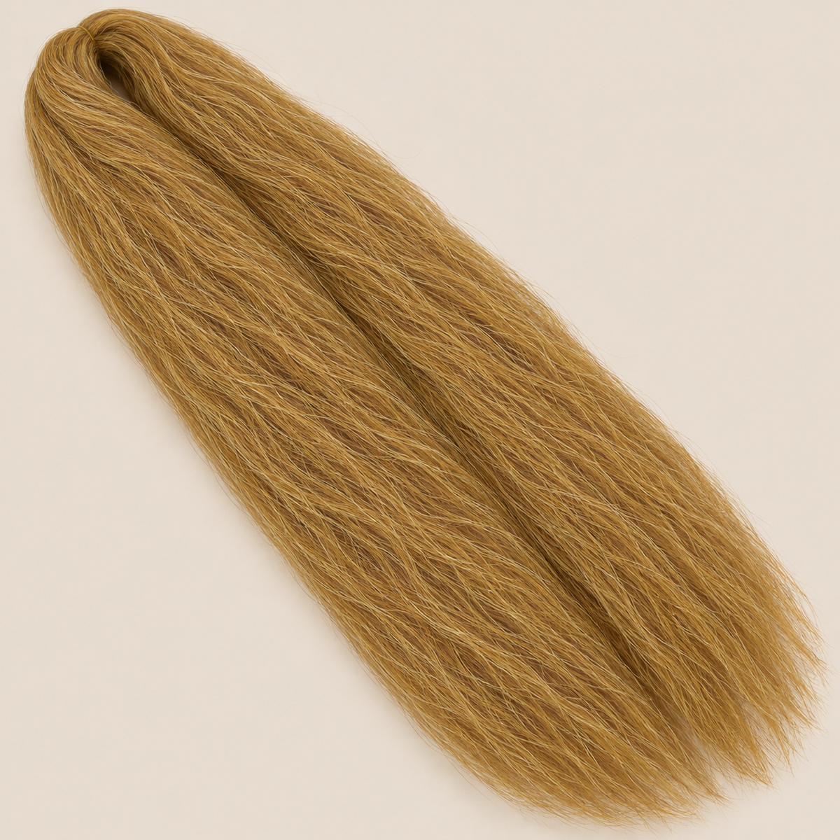Ultra Braid kanekalon 27 honingblond 100 cm, 165 gram op beige achtergrond